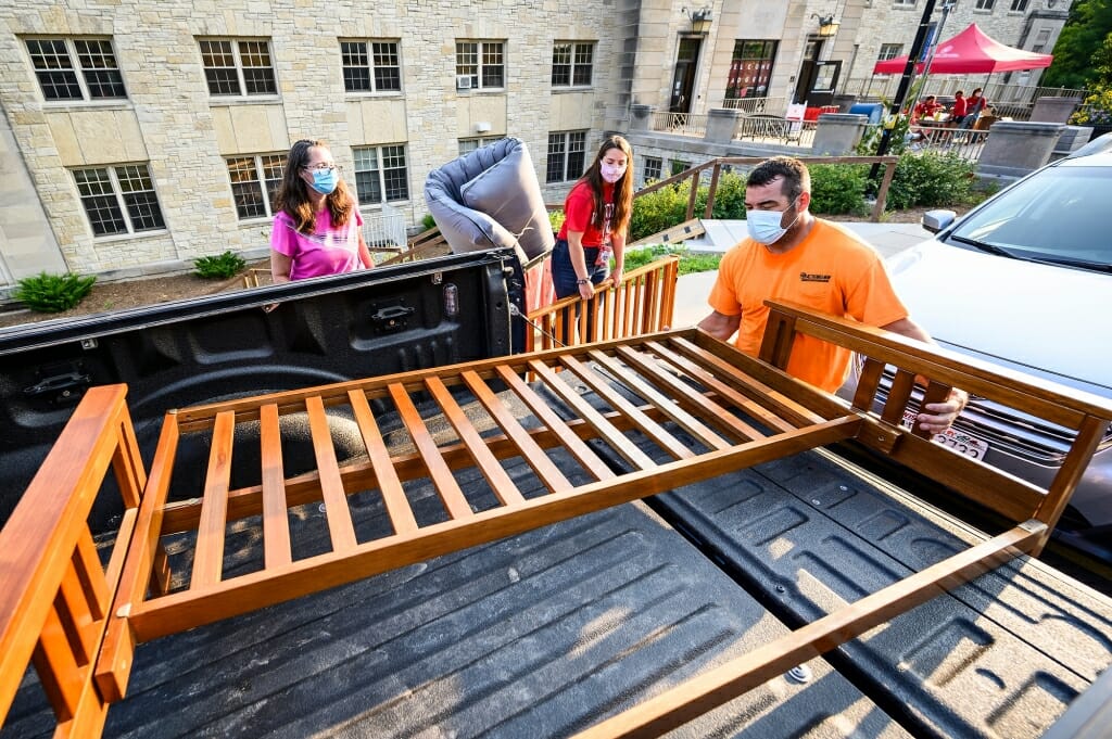 Vicki and Mark Chrostowski unload a futon frame for their daughter Maggie's room.