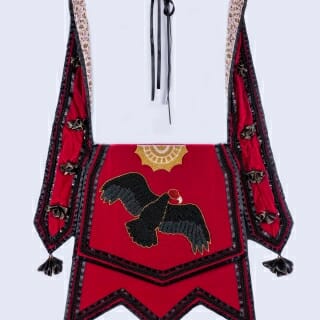 This shoulder bag illustrates a Native American story told through Iroquois raised beadwork by award-winning artist Karen Anna Hoffman.