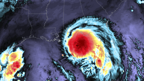 A satellite image of a hurricane making landfall off the eastern coast of Florida