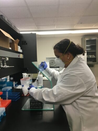 Aisha Mergaert working in a lab