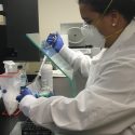 Aisha Mergaert working in a lab