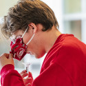 UW student Sam Kavajecz fills a vial with saliva. When providing a test, pool your drool underneath your tongue as you walk or drive to your test site.
Think about foods you really like to eat. 