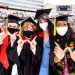 Four graduates flash the 
