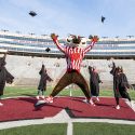 UW's Senior Class Officers do a test run of a commencement celevration with Bucky Badger in Camp Randall Stadium on March 9.
