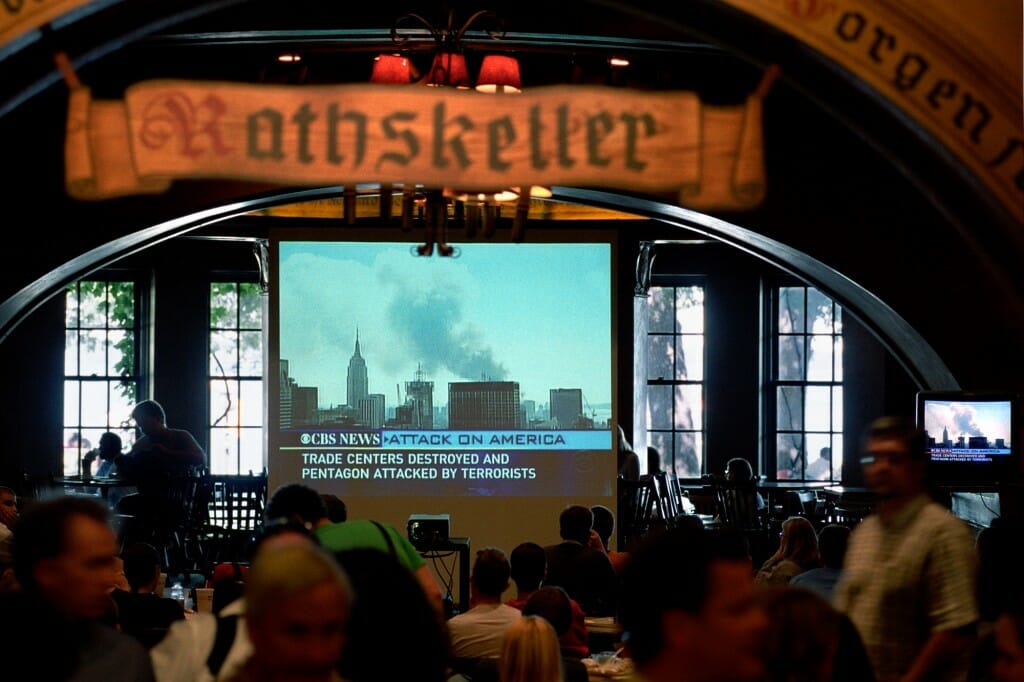TV broadcast projected on screen in Rathskeller