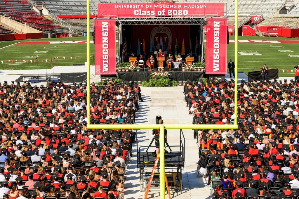 Wide shot of stage and seated grads