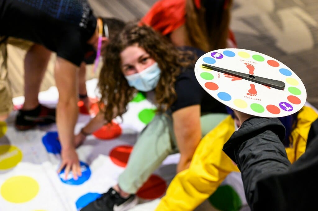 A group of mostly first-year students play a game of Twister during a Halloween Bash at Dejope Residence Hall.