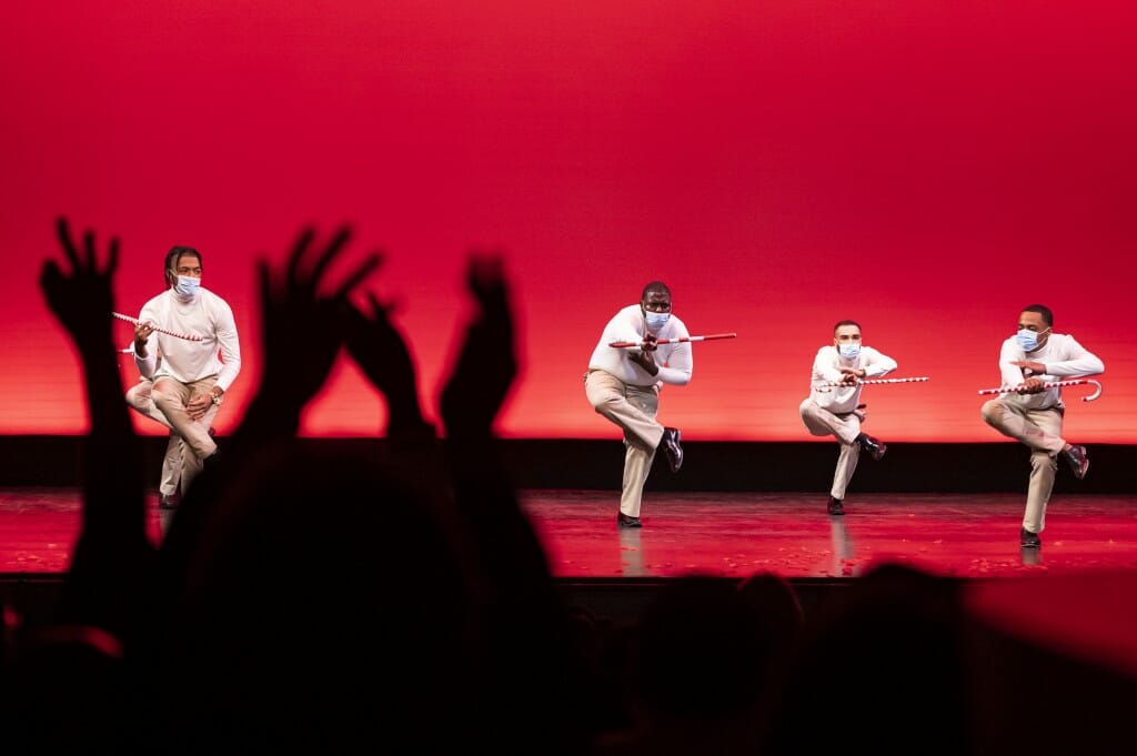 The audience applauds as members of the Kappa Alpha Psi Fraternity perform during the Multicultural Homecoming Yard Show.