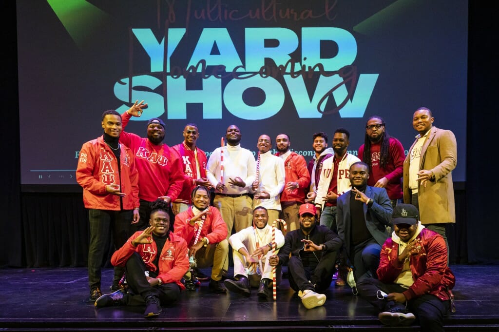Members of the Kappa Alpha Psi Fraternity gather on stage for a group photo following the Multicultural Homecoming Yard Show.