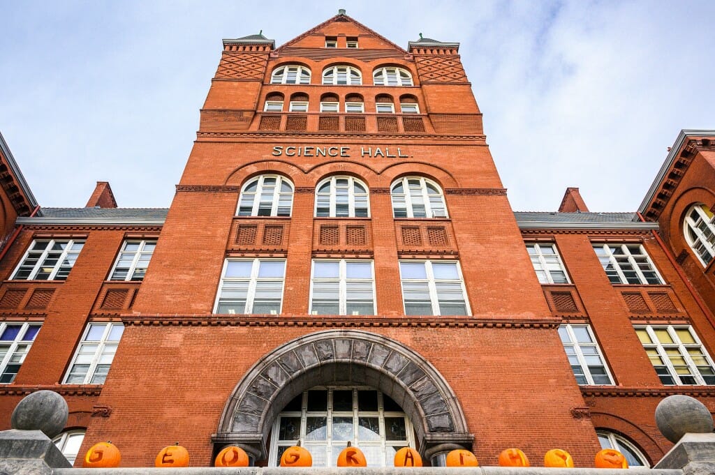 Carved pumpkins spell out GEOGRAPHY in front of Science Hall.