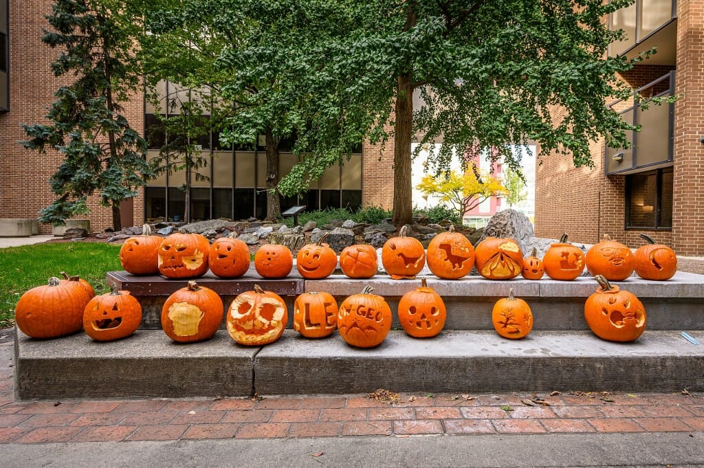 Carved pumpkins are displayed outside Weeks Hall for Geological Sciences.