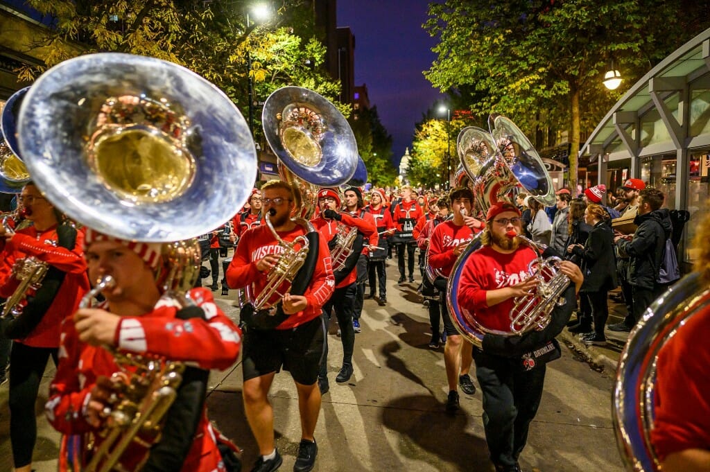The UW Marching Band wows spectators on State Street as the group closes out the Homecoming parade on a high note.