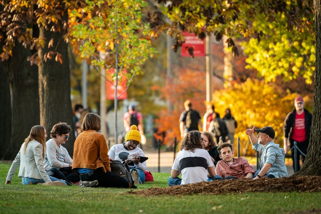 Swapping out desks, chairs and chalkboards for a patch of lawn under a canopy of trees, a class meets on Bascom Hill. If this were always an option, Zoom would be doomed.