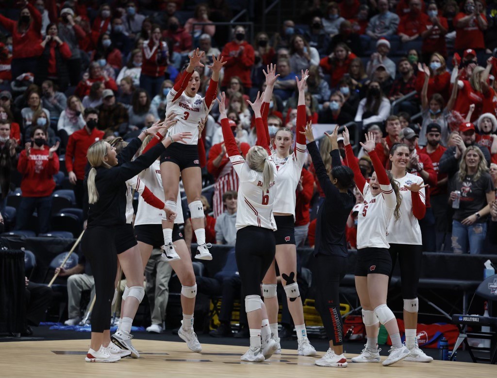 The team celebrates a won point.