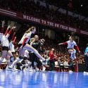 Badgers volleyball players celebrate after winning a set in the NCAA regional final against Minnesota.