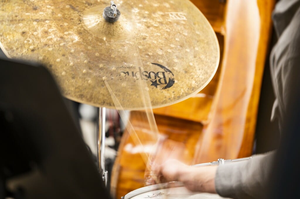 A drummer in the jazz ensemble keeps the beat.