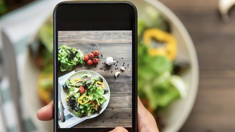 Photo illustration of food on a cellphone screen