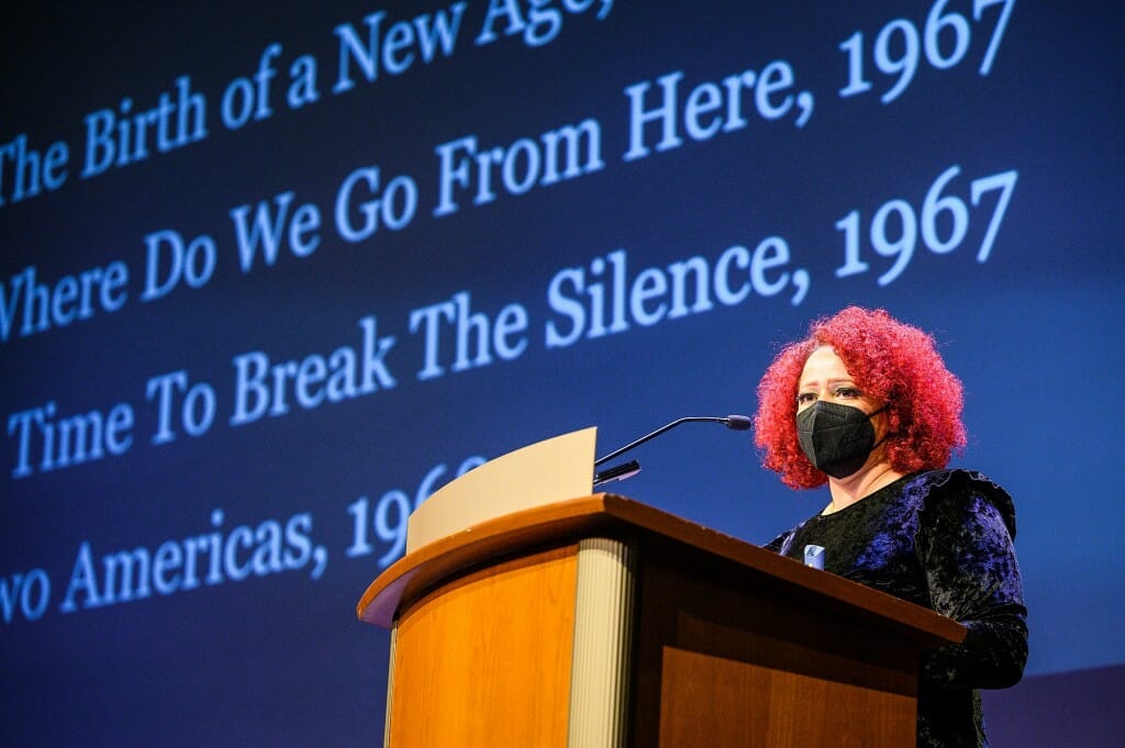 Hannah-Jones speaking from a podium