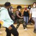 HitmakerChinx (left) offers tips to participants as he leads them in a dance.