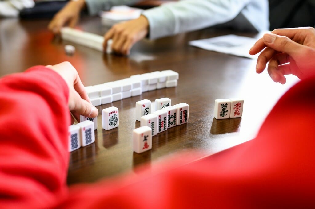 Photo: Someone arranges their Mahjong tiles.