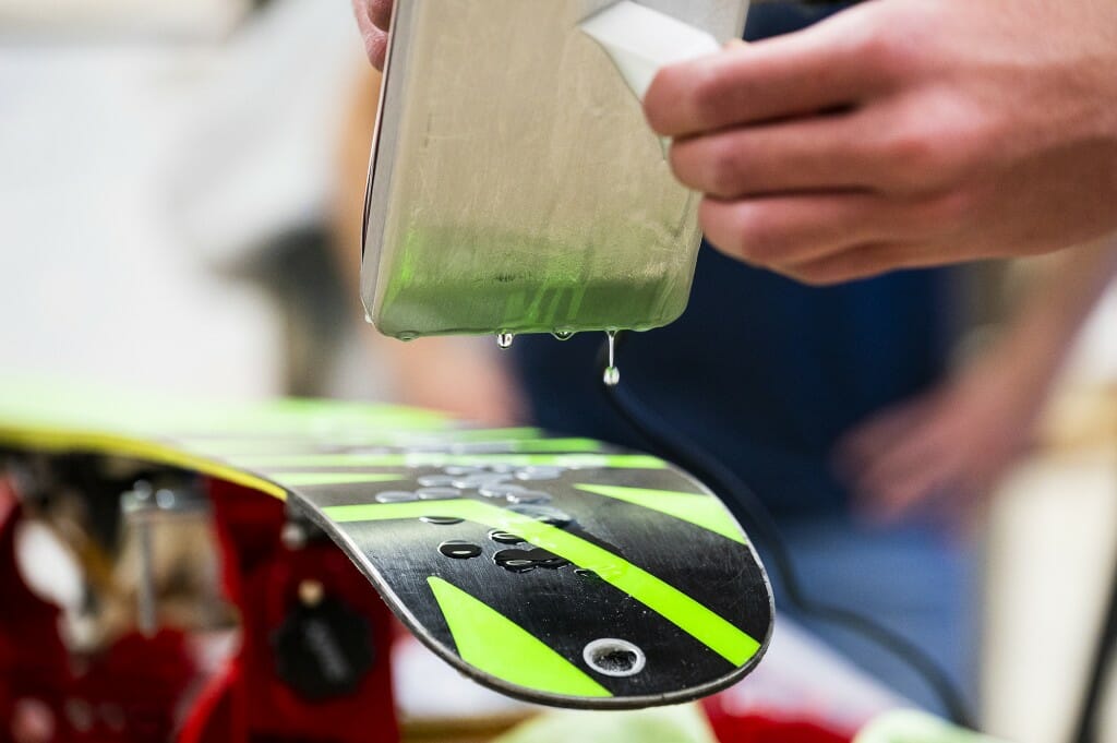 Wax is applied to the skis first.