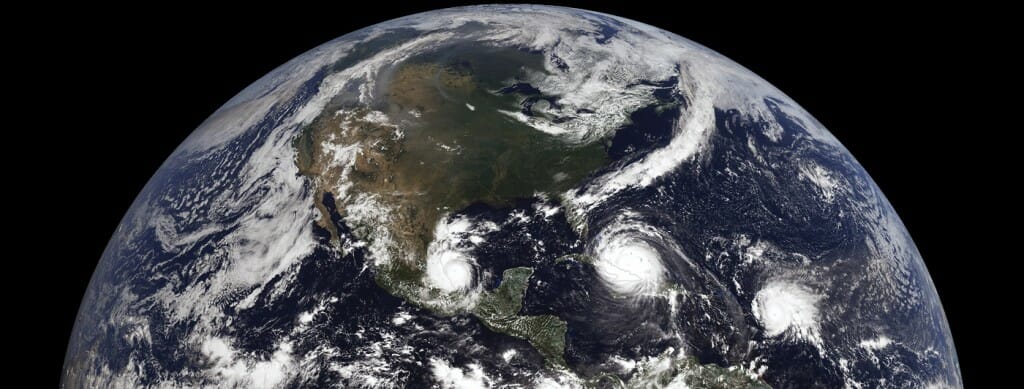 A satellite image showing clouds in a swirling hurricane pattern.