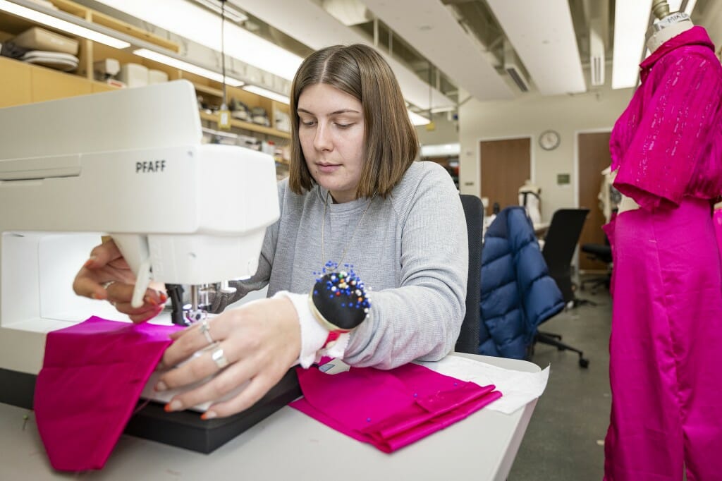 Mia Cherti works on garment construction in professor Carolyn Kallenborn’s Collection Development course in the School of Human Ecology.