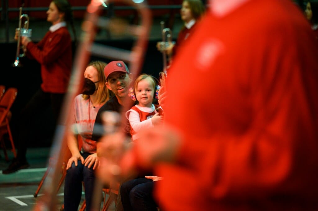 Ila Hellgren, a 2 ½ year old marching band fan, watches the UW Varsity Band Spring Concert dress rehearsal in the Kohl Center.