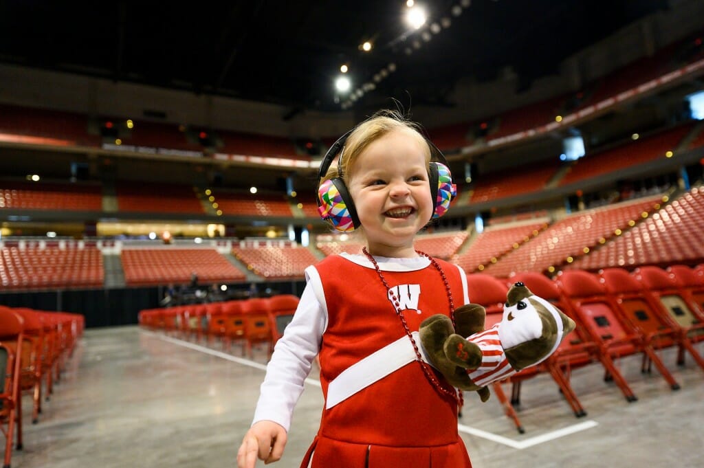 Ila Hellgren, a 2 ½ year old marching band fan, watches the UW Band’s dress rehearsal.