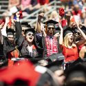UW graduates celebrate receiving their degrees.
