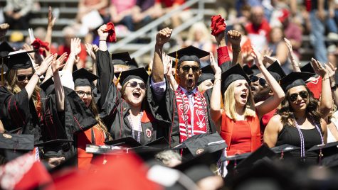 UW graduates celebrate receiving their degrees.