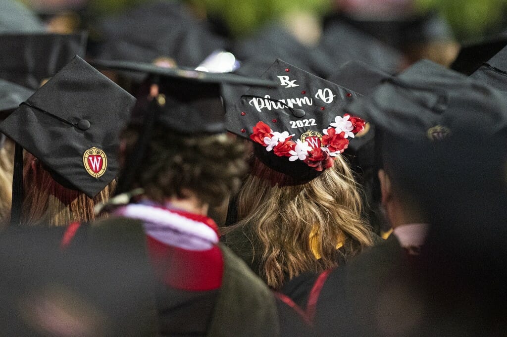 View of several mortarboards, including one saying 