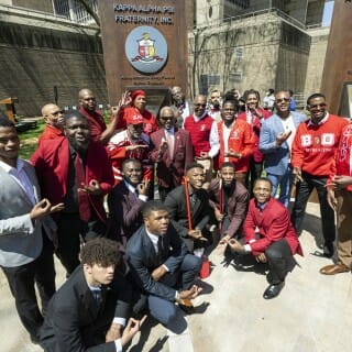 Members of Kappa Alpha Psi Fraternity, Inc., are pictured with their plaque.