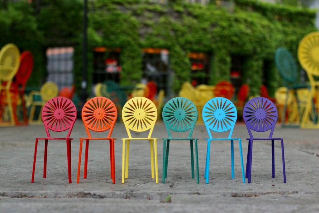 A display of Terrace chairs in the colors of pride month.