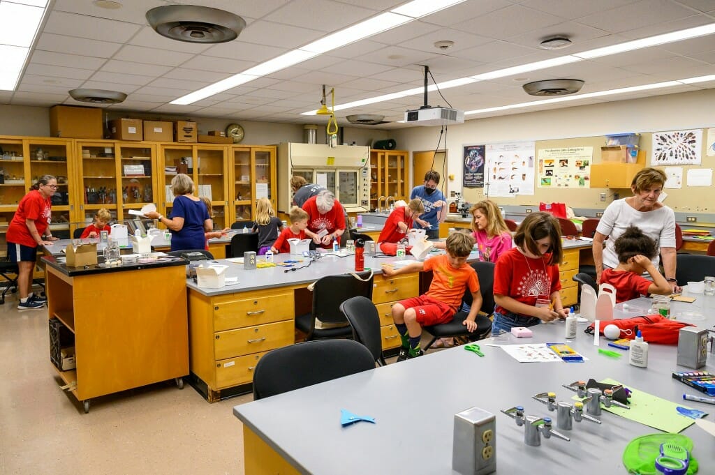 Grandparents University participants are busy pinning bugs that they collected the previous day during an entomology class. 