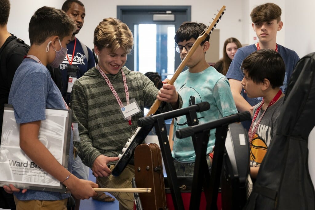 At a Summer Music Clinic Junior Session, students pack the equipment up as they get ready to head to their next session.