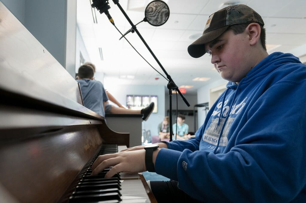 Duncan, a pianist of 8 years, practices in preparation for recording a song for the final project for Summer Music Clinic.