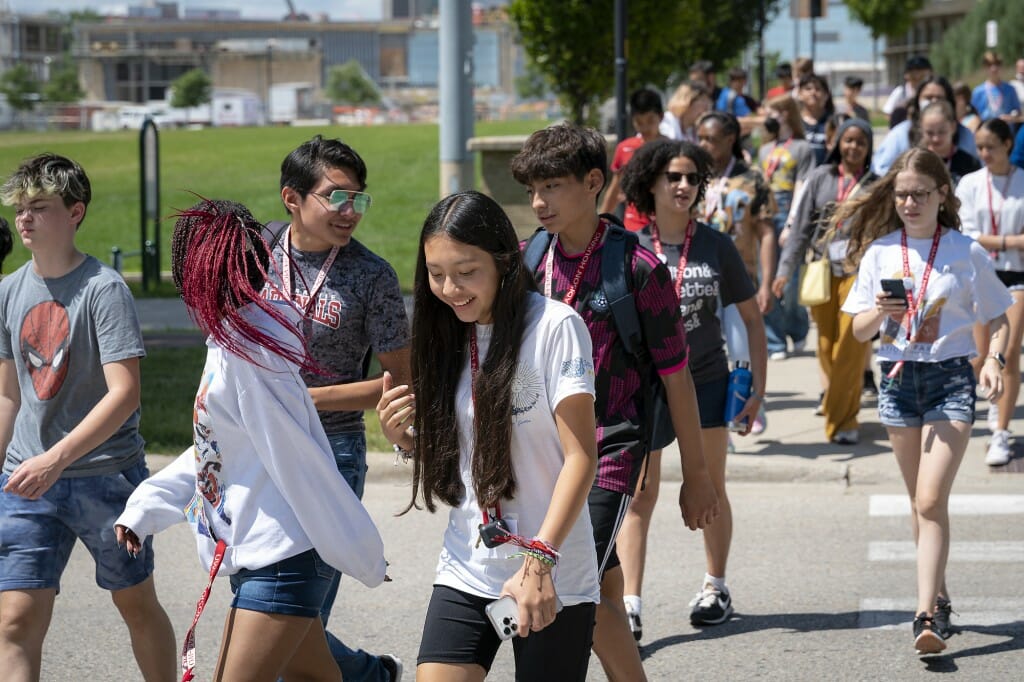 The Summer Transitional Enrichment Program, a two-week residential camp, focuses on academic rigor and social-emotional development. Middle School students at a STEP camp make their way from lunch at Dejope Residence Hall to the Microbial Sciences Building to attend classes.