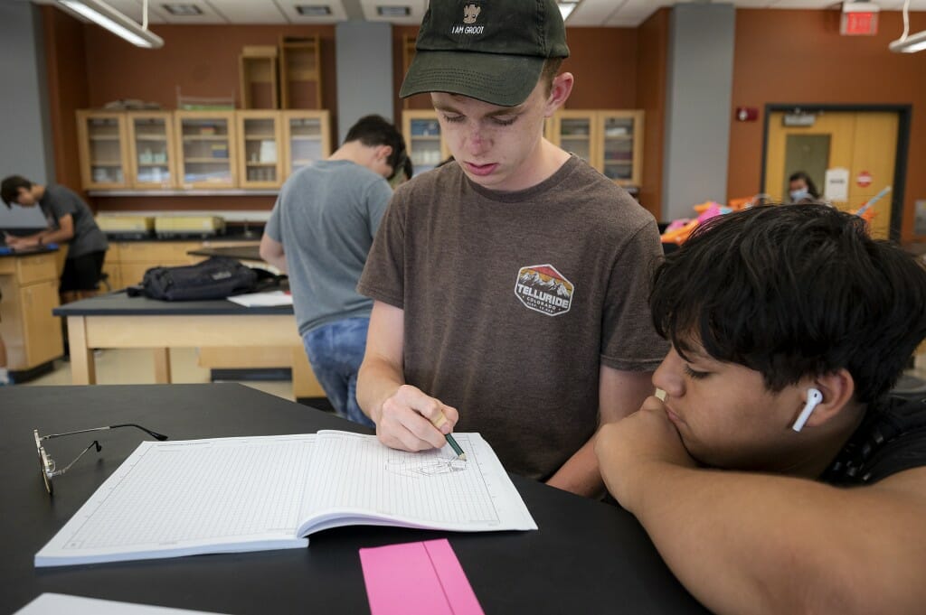 Students in the Engineering Design Challenges class, taught by Linda Malkin, brainstorm ideas for structures for an egg transport designed to keep the egg safe during impact. The class was part of the STEP program.