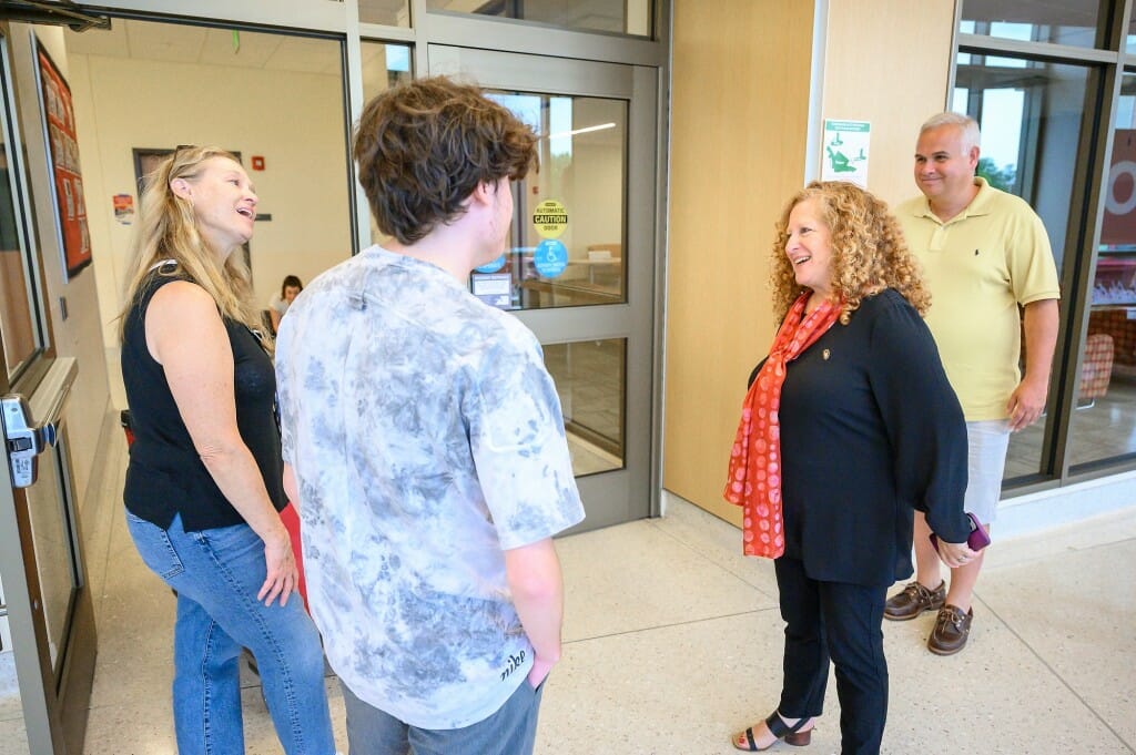 Chancellor Mnookin greets first-year student Charlie Pallares and his mom Kim Pallares as they move in to Dejope Residence Hall. Mnookin, a California transplant herself said, 