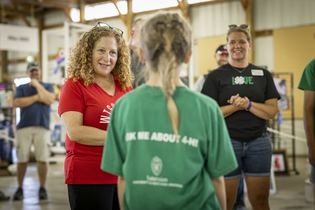 Chancellor Mnookin talks with Arabelle Steffens while visiting with members of the local 4-H Club.
