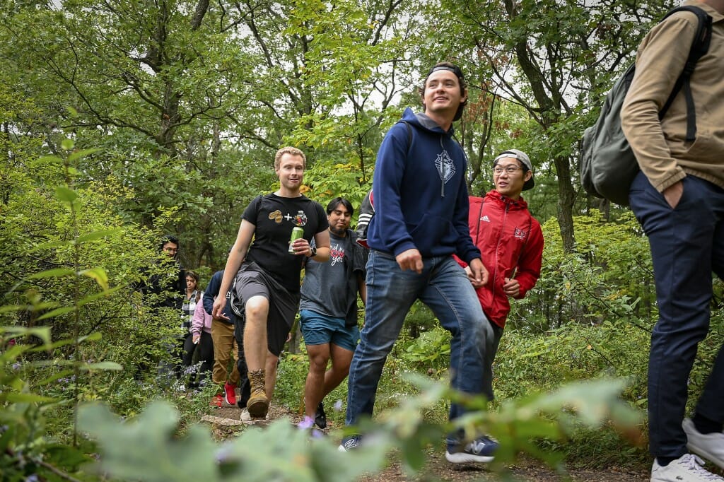 A group of students hike at a state park