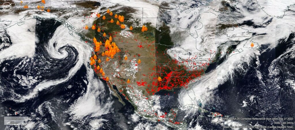 A satellite image of North America with fire icons overlaid in areas with active wildfires