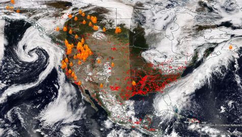 A satellite image of North America with fire icons overlaid in areas with active wildfires