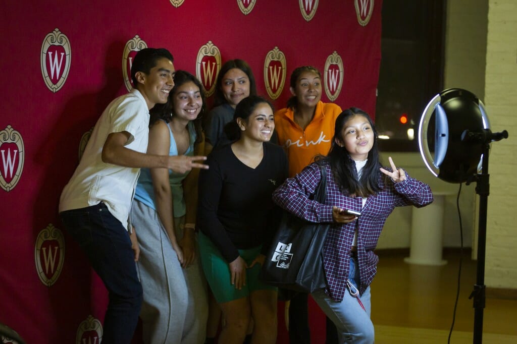 Students (from back to front, left to right) Alejandro De La Torre, Ariadna Marquez, Lupita Perez, Jasmine De Luna, Diana Rico and Lesley Ramirez pose for a picture at a photo station.