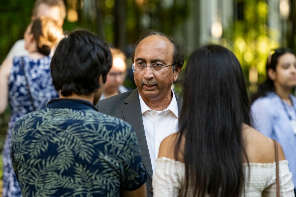 Vallabh Sambamurthy, dean of the Wisconsin School of Business, talks with attendees.