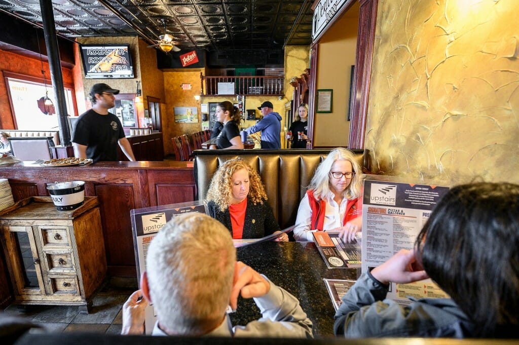 Chancellor Mnookin (back left) sits with (clockwise) Glenda Gillaspy, dean of the College of Agricultural and Life Sciences (CALS); Crystal Potts, director of state relations with University Relations; and state Sen. Howard Marklein at Steve’s Pizza in Platteville.