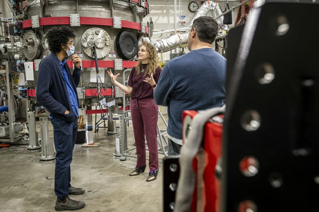 Nasser tours the lab of Steffi Diem, center, professor of engineering physics in the College of Engineering, in the Engineering Research Building. Diem runs the Pegasus-III Experiment, which is working on ways to reduce the cost and complexity of fusion power plants in the future.