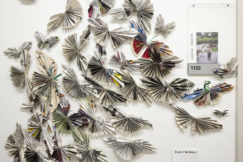 Some paper butterflies are pasted to the wall.