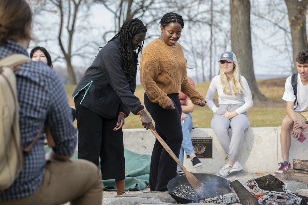 With the fire hot, food is cooked over it in the traditional manner.